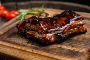 grilled meat steak on a wooden board with spices in a premium restaurant
