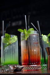 Three assorted cocktails at the bar 