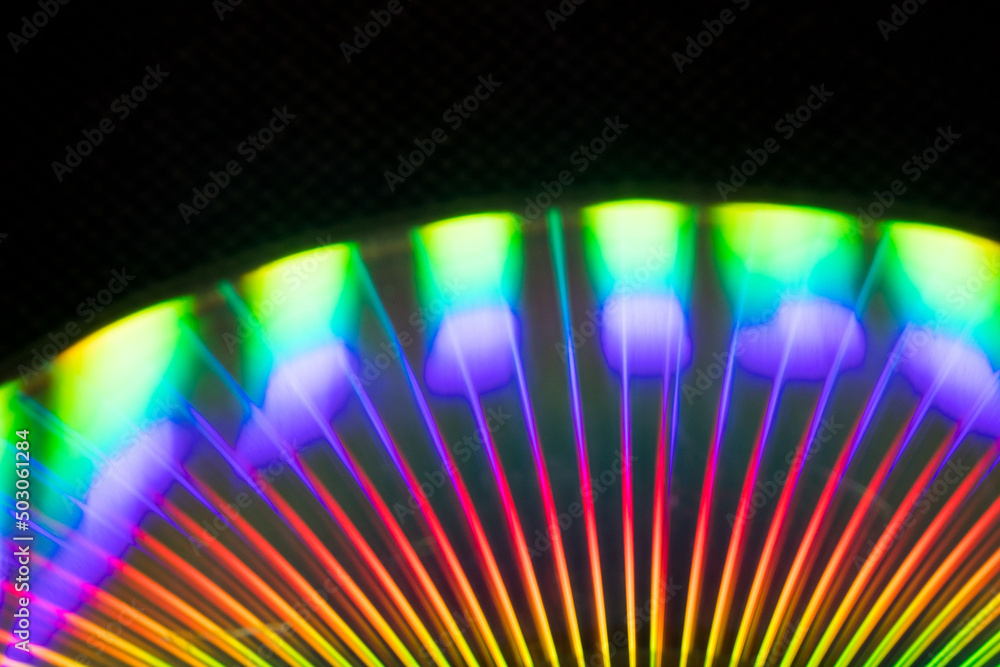 Poster reflection of light in a compact disk(cd) or digital versatile disk(dvd).
