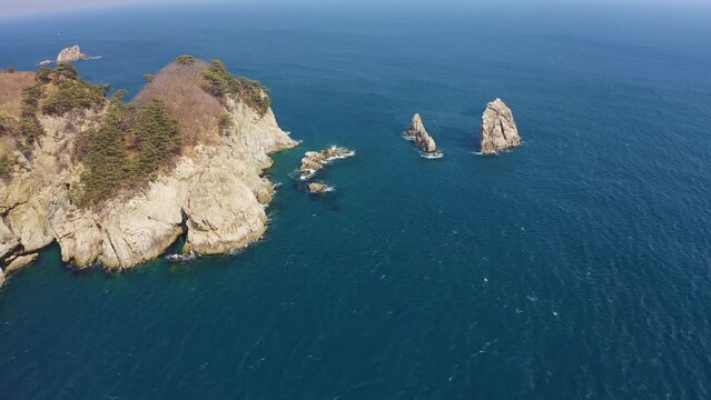 Kekura and rocky Cape Telyakovsky washed by the Sea of Japan on a sunny day. Far Eastern Marine Reserve. National park. Drone view. The concept of protecting protected areas