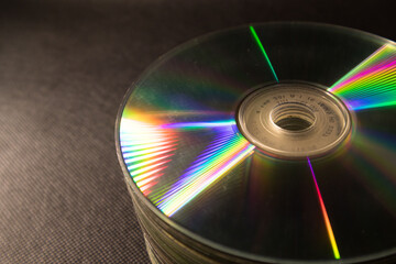 Old CDs,DVDs are stacked in black background
