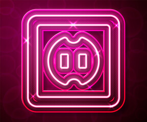 Glowing neon line Electrical outlet icon isolated on red background. Power socket. Rosette symbol. Vector