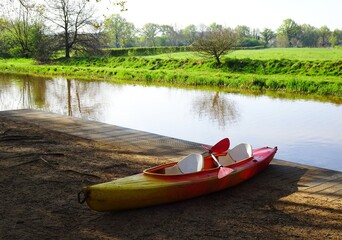Kayak next to the Kleine Nete river. Boat on the side, at the Waterral in Herentals, Belgium.