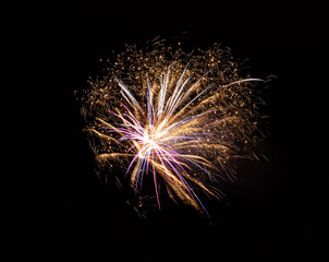 Beautiful shot of exploding colorful fireworks in a black sky