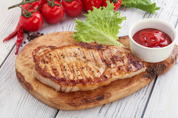 Grilled pork steak with ketchup