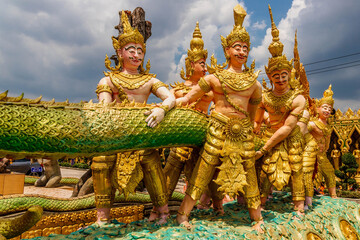 Closeup of deities statues in a buddhist temple in Thailand.