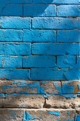 Vertical closeup shot of the blue grunge brick wall