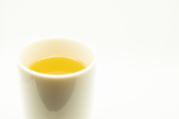 Green tea on a white background. Image of Japanese green tea. Cup of tea isolated on white background