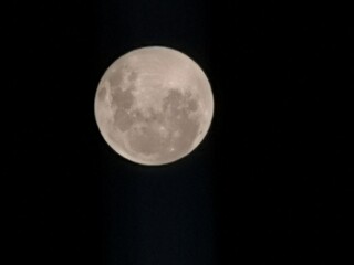 full moon over blue sky