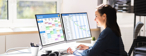 Employee Working On Calendar Schedule