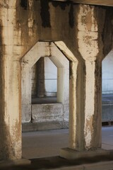 Fototapeta premium Old concrete arch supporting an urban structure.