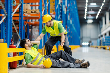 A warehouse worker waking up his colleague.