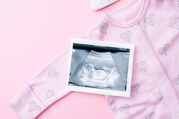 Ultrasound image pregnant baby photo. Fashion cute baby cloth with ultrasound pregnancy picture on...