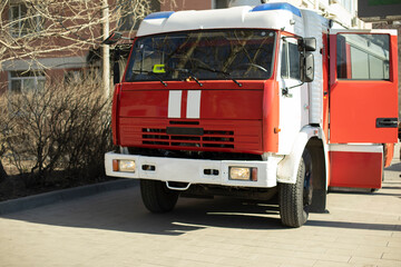 Fire truck on street. Rescue service. Special transport for extinguishing fire.
