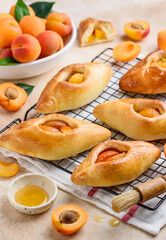 Pies from yeast dough with apricots.  Homemade fruit summer pasties or patties.  Pirozhki. Selective focus