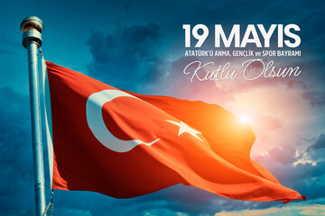 Turkey flag waving in the wind over cloudy sky during sunrise. 19 Mayis Ataturk'u Anma, Genclik ve Spor Bayrami Kutlu Olsun. English: "May 19, Happy Commemoration of Ataturk, Youth and Sports Day.