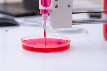 Research 3D bioprinter   for  3D print cells onto an petri dish. Biomaterials engineering concepts....
