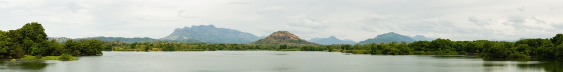 Fototapeta na wymiar Panaroama of hilly tropical landscape with large lake