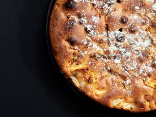 Homemade apple pie on a dark background