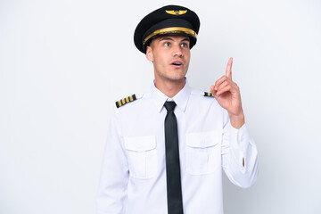 Airplane caucasian pilot isolated on white background thinking an idea pointing the finger up