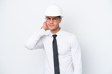 Young architect caucasian man with helmet and holding blueprints isolated on white background having doubts