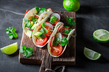 Mexican and spicy tacos with avocado, coriander and lime.