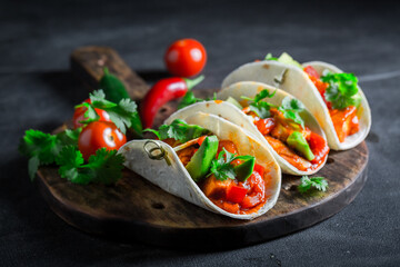 Tasty and vegetarian tacos as small colorful appetizer.