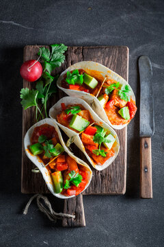 Vegetarian and healthy tacos as small colorful appetizer.