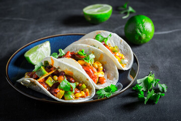 Vegetarian and healthy tacos as quick snack for party.