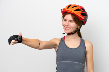 Young cyclist English woman isolated on white background giving a thumbs up gesture