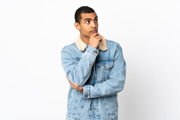 African American man over isolated white background thinking an idea while looking up