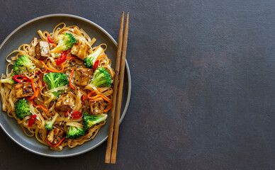 Udon noodles with tofu, broccoli, carrots, pepper and sesame. Healthy eating. Vegetarian food....