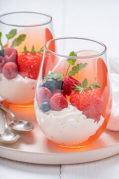 Creamy and delicious jelly with berries and whipped cream.
