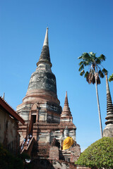 Fototapeta premium Wat Yai Chaimongkol. ancient buddha Wat Yai Chaimongkol Ayutthaya historical city, Thailand, beautiful blue sky