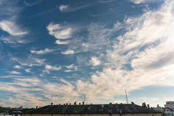 Kyiv, Ukraine – June 26, 2020: Unusual beautiful gentle little white clouds in the city, blue sky