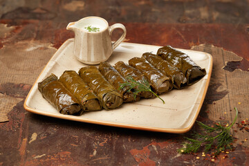 Green shrub dolma with white sauce