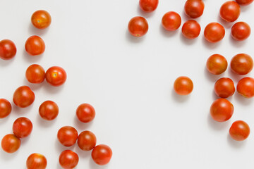 Cherry tomatoes with copy space on white background.
