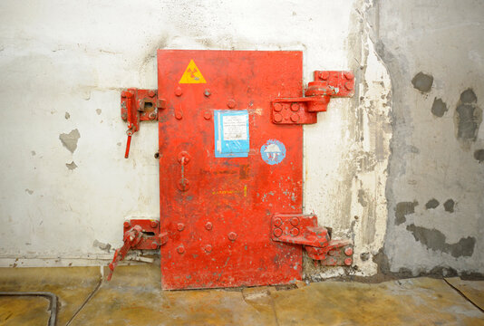 Metal Protective Door To The Block With Contaminated Radioactive Equipment Placed After Disaster In 1986. Chernobyl Nuclear Power Plant, Ukraine