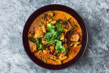 vegan broccoli tofu and onion curry with fresh coriander and herbs as topping, healthy plant-based food recipes - obrazy, fototapety, plakaty