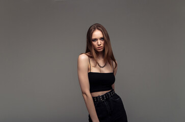 Naklejka premium Pretty female with fair hair, dressed casually, looking with satisfaction at camera, being happy.