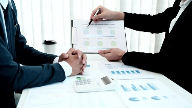 Brainstorming and Business Consulting, Marketer presents Graph data and plan marketing strategies for executives who attend team meetings to analyze and develop the organization to grow, Teamwork.