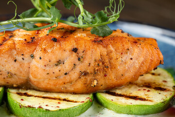 Grilled salmon steak with zucchini and creamy sauce