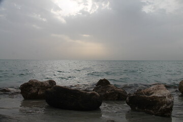 Wonderful view of the rocks in front of the sea at sunrise