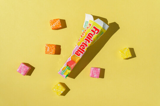 Tyumen, Russia-April 03, 2022: Fruittella chery sweet made by Perfetti Van Melle, on a yellow background