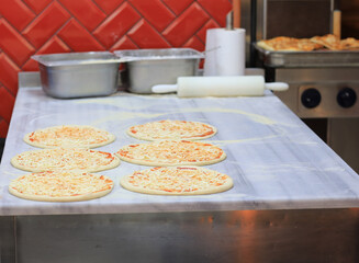 cooking pizza in the kitchen