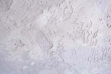 artistic plaster on a gray and white wall. Repairs. elements of wall decor. copy space. texture. background.
