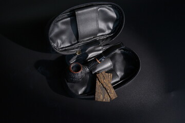 classic bent apple pipe in leather pouch with tabaco