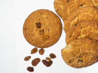 Oatmeal raisin cookies on a white background. Sweets. Broken tea biscuits.