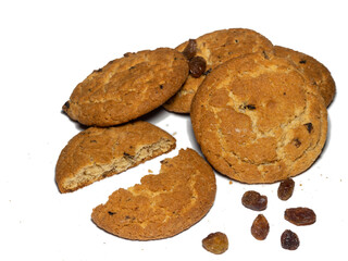 Oatmeal raisin cookies on a white background. Sweets. Broken tea biscuits.