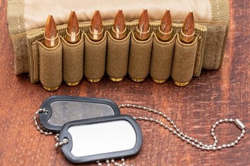 Army identification medallions, bandolier with cartridges, Concept: military special operation,...